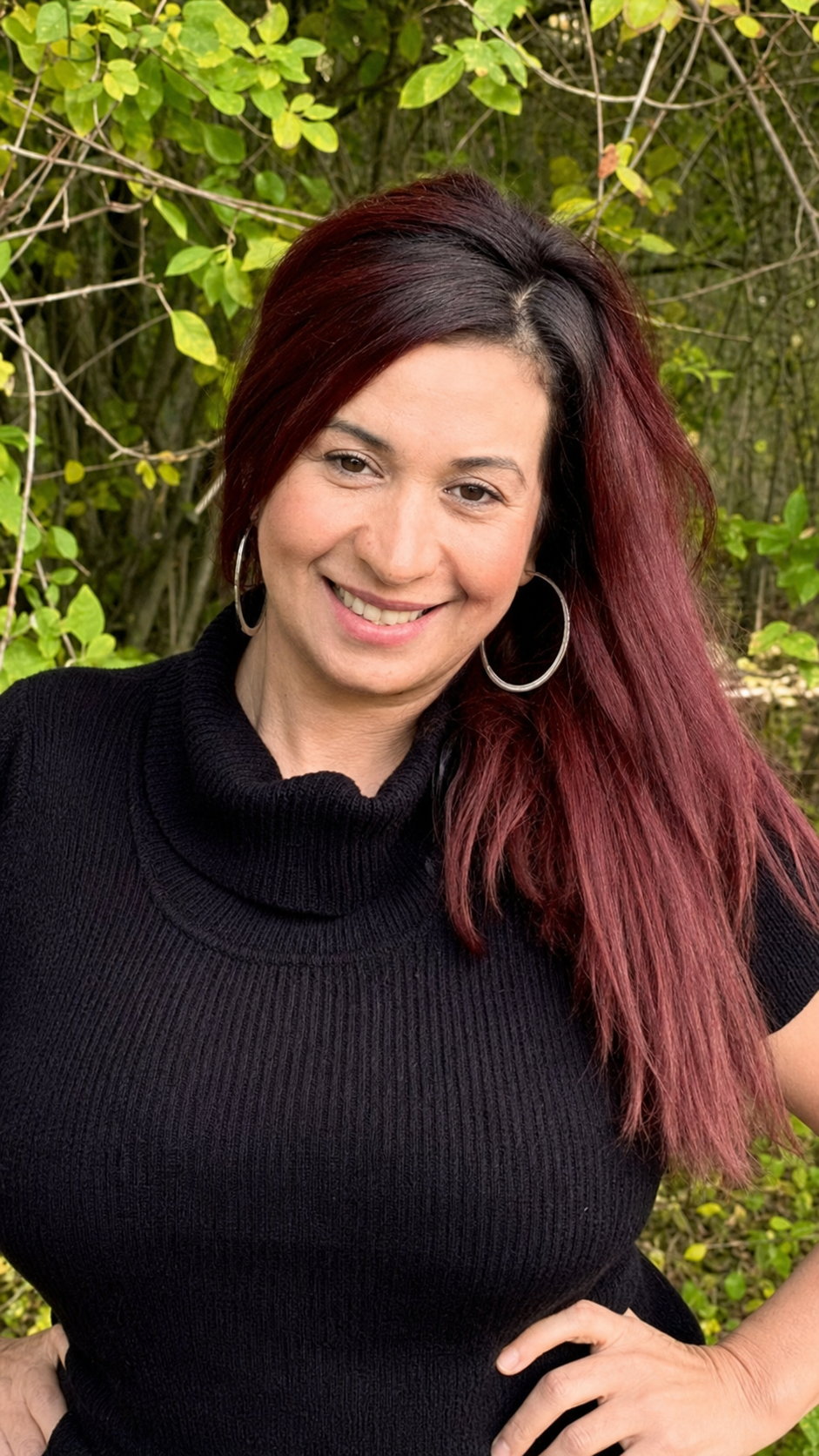 Michelle D. Elder, MSW, LMHC, smiling outdoors in nature
